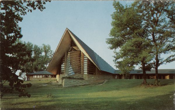 Text on reverse reads: "The meeting house of the First Unitarian Society of Madison, Wisconsin, Frank Lloyd Wright, architect. The prow or apex pointing North is a steeple within the building. It is enclosed by louvers of 2 to 12 inch planks, the space between being filled by stationary panes of glass 2 by 4 feet long." A designated U.S. Historical Landmark.