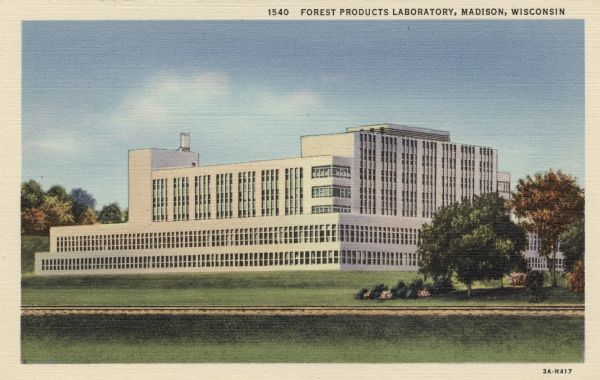 Exterior view of the Forest Products Laboratory. Mid-20th Century architecture near railroad tracks. Caption Reads: "Forest Products Laboratory, Madison, Wisconsin."

Text on reverse reads: "The Forest Products Laboratory at Madison, Wisconsin, is the largest institution in the world devoted exclusively to research in wood and other forest products. It is maintained by the Federal Forest Service. United States Department of Agriculture, it functions in co-operation with the University of Wisconsin."