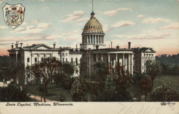 Exterior view of the Capitol building before the 1904 fire. The State Seal is in the upper left corner. Caption reads: "State Capitol, Madison, Wisconsin."