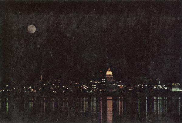 View of the Madison skyline from Lake Monona in the moonlight.
