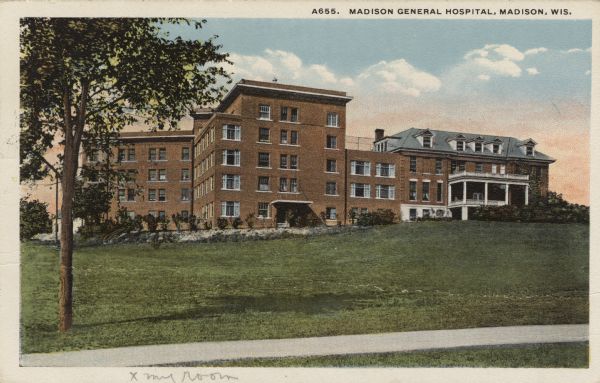 Exterior view of a 5-story brick hospital. Addition attached to an original building. Caption reads: "Madison General Hospital, Madison, Wis."