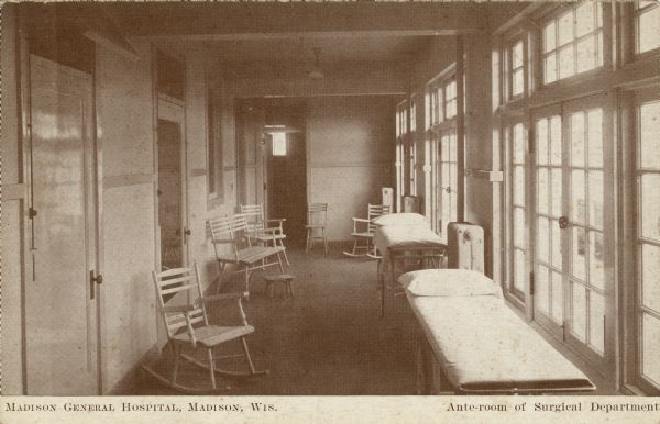 Interior view of the surgery ante-room. Gurneys in a brightly lit hallway. Doors out to the balcony. Caption reads: "Madison General Hospital, Madison, Wis. Ante-room of Surgical Department."