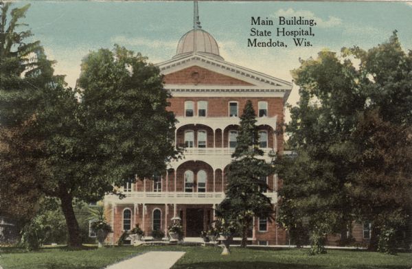 Exterior view of the main building of Mendota State Hospital. Caption reads: "Main Building, State Hospital, Mendota, Madison, Wis."