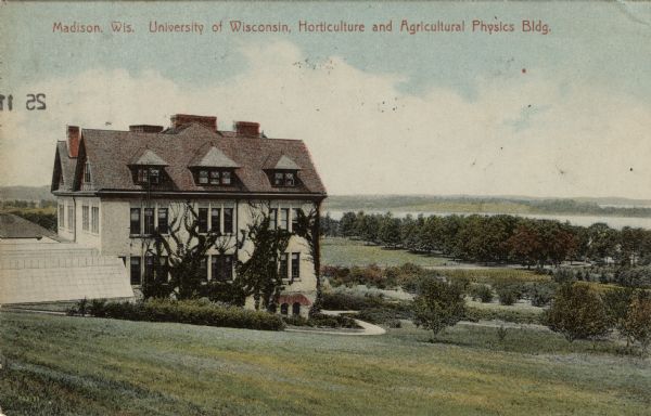 Exterior view of the Agriculture building on the University of Wisconsin campus overlooking Lake Mendota. Greenhouses are on the left. Caption reads: "Madison, Wis. University of Wisconsin, Horticulture and Agricultural Physics Bldg."