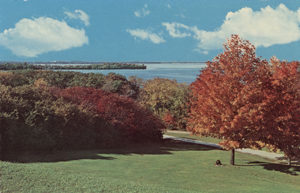 View of Picnic Point from Observatory Hill on the University of Wisconsin campus. Autumn color is in the trees.