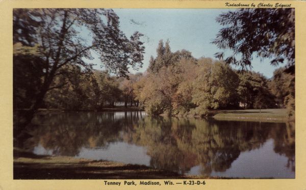 View of the lagoon at Tenney Park with reflections of fall foliage. Caption reads: "Tenney Park, Madison, Wis."
