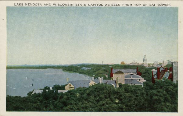 Illustrated postcard view of the south shore of Lake Mendota, with university buildings on the lower campus, and the Wisconsin State Capitol on the horizon. Caption reads: "Lake Mendota and Wisconsin State Capitol as seen from Top of Ski Tower."