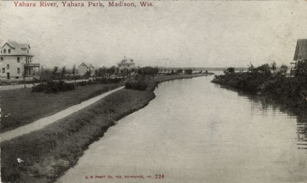 View down the Yahara River towards where it enters Lake Monona at Yahara Park. There are a few houses on either side of the river. Caption reads: "Yahara River, Yahara Park, Madison, Wis."