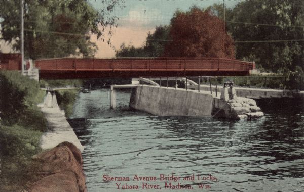 View of a bridge and lock on the Yahara River near Tenney Park. Caption reads: Sherman Avenue Bridge and Locks, Yahara River", Madison, Wis."