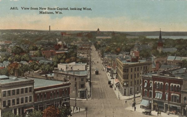 Elevated view of State Street from Capitol Square to the lower university campus. Lake Mendota is on the right. Caption reads: "View from New State Capitol, Looking West, Madison, Wis."