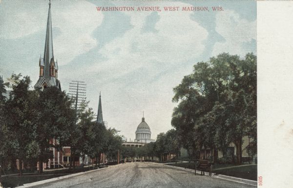 View down West Washington Avenue facing towards the Capitol. Church buildings are on the left. Caption reads: "Washington Avenue, West Madison, Wis."