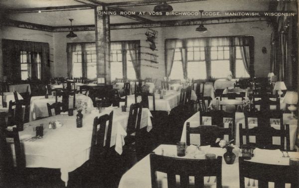 Interior view of the restaurant's dining room. Caption reads: "Dining Room at Voss Birchwood Lodge, Manitowish, Wisconsin."