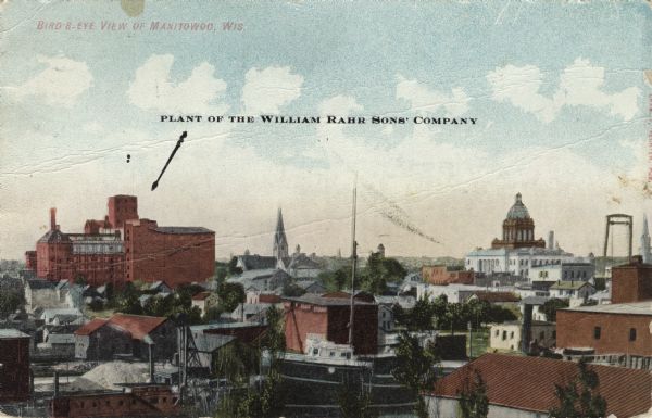 Birds-eye view of central Manitowoc. The plant of the William Rahr Sons' Company has an arrow pointing to it. The Manitowoc County Courthouse on the right is prominent against the horizon. Caption reads: "Bird's-Eye View of Manitowoc, Wis."