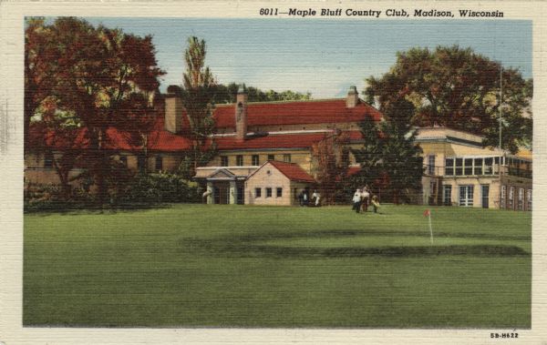 Exterior view of the Maple Bluff Country Club. There is a group of people standing on the golf course. Caption reads: "Maple Bluff Country Club, Madison, Wisconsin."