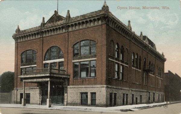 Exterior view of the Marinette Opera House on a street corner. Caption reads: "Opera House, Marinette, Wis."