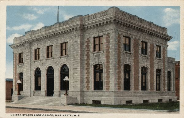 Exterior view of the main post office, with lampposts at the arched entrance. Caption reads: "United States Post Office, Marinette, Wis."