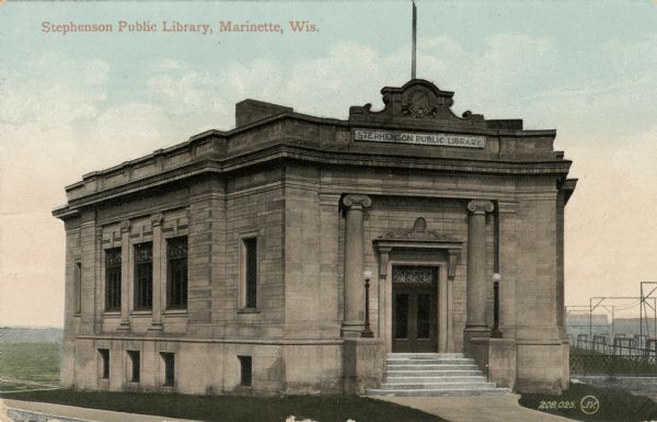 Exterior view of a library building near a bridge. Caption reads: "Stephenson Public Library, Marinette, Wis."