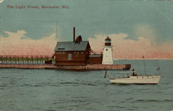 View across water towards a lighthouse and adjoining building at the end of a wharf. A boat is on the lake in the foreground. Caption reads: "The Light House, Marinette, Wis."