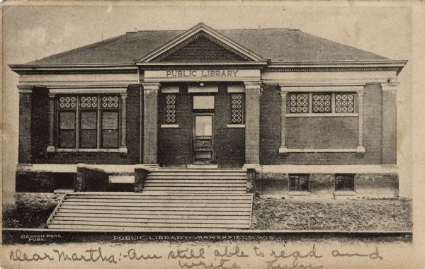 View of the front of the Marshfield Public Library. Caption reads: "Public Library, Marshfield, Wis."