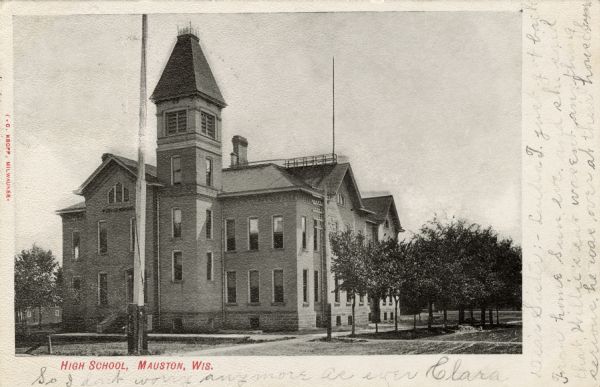 Exterior view of a high school with a bell tower. Caption reads: "High School, Mauston, Wis."