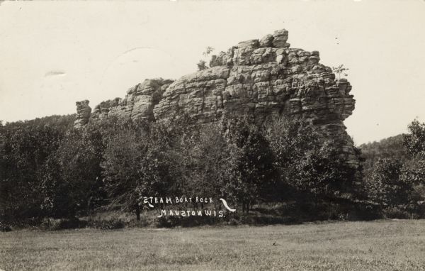 View of Steamboat Rock, a rock formation near Mauston. Caption reads: "Steamboat Rock, Mauston, Wis."