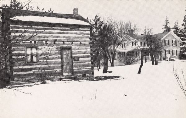 Winter view of Umhoefer Log Cabin, built in 1845. Located at Pilgrim Road and County Line "Q." Text on back reads: "The Miller-Davidson House is a 19th Century limestone farmhouse with furnishings spanning 200 years."