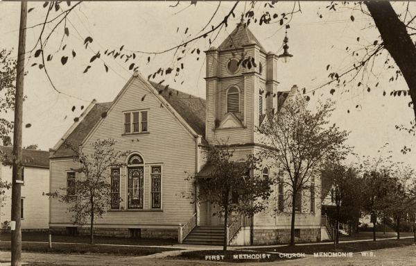 Exterior view of the Menomonie First Methodist Church. Caption reads: "First Methodist Church, Menomonie, Wis."