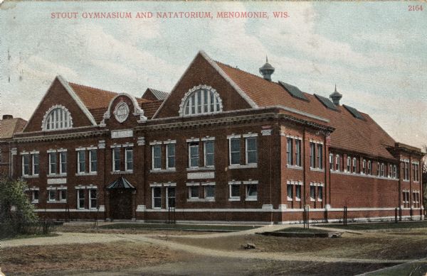 Exterior view of the gymnasium at Stout. Caption reads: "Stout Gymnasium and Natatorium, Menomonie, Wis."