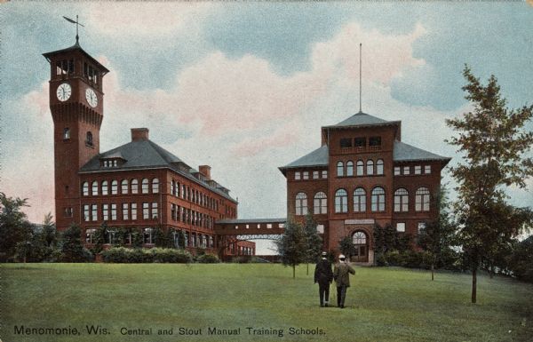 Central High School and Stout Manual Training School connected by pedestrian bridge. Two men are walking on the lawn towards the buildings. Caption reads: "Menomonie Wis. Central and Stout Manual Training Schools." Text on back reads: "Menomonie, Wis. is on the Red Cedar River and Lake Menomonie 66 miles from St. Paul. It was named by Capt. Wm. Wilson, in 1846, for the Indian tribe of that name. The word means "Wild Rice." There are extensive manufacturing interests here. The surrounding region is a fine agricultural and stock-raising district."