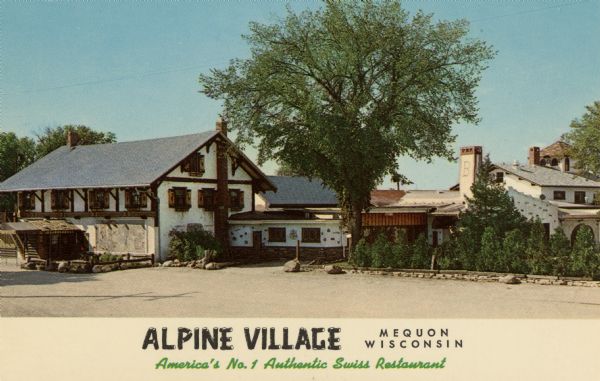 View of Alpine Village. Caption reads: "Alpine Village, Mequon, Wisconsin. America's No. 1 Authentic Swiss Restaurant." Located on Hwy 57 near Mequon.