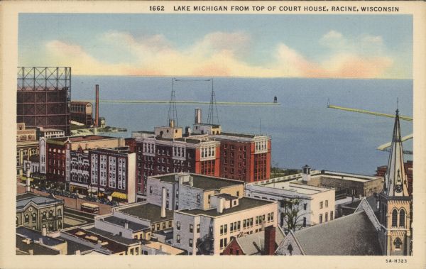 Text at top reads: "Lake Michigan from Top of Court House, Racine, Wisconsin." An elevated view of Racine including the harbor. Buildings, rooftops, signs, the gas works storage tank, Lake Michigan, harbor facilities and the breakwater can be seen. The Hotel Racine in the middle has an interesting radio antenna on top. The Post Office and St. Luke’s Episcopal Church are on the right.