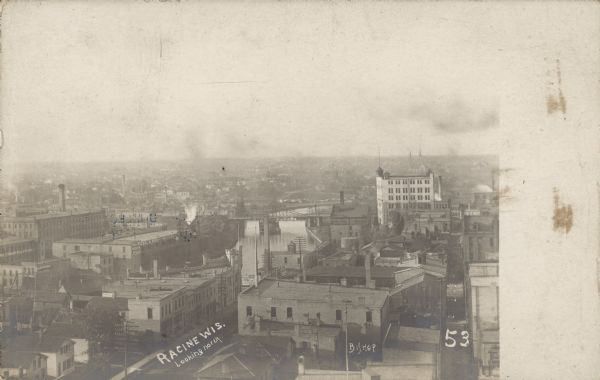Text on front: "Racine, Wis. Looking North." Elevated view of the city's business center, looking North.