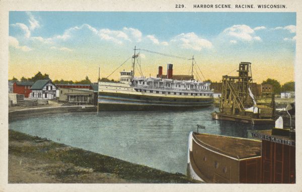 Text on front reads: "Harbor Scene, Racine Wisconsin." A large ship is docked in Racine's harbor, with another ship and harbor facilities.