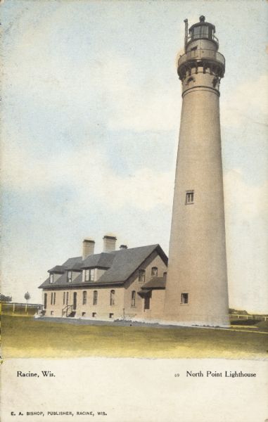 Text on front reads: "Racine, Wis.", "North Point Lighthouse". This is actually the Wind Point Lighthouse on Wind Point, located on the north end of Racine Harbor. The lighthouse is 108 feet tall and is one of the oldest and tallest active lighthouses on the Great Lakes. It became operational in 1880 and was listed on the National Register of Historic Places in 1984.