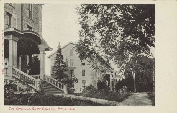 Text on front reads: "The Commons, Ripon College. Ripon, Wis." A sidewalk runs past several college buildings shaded by trees. 
