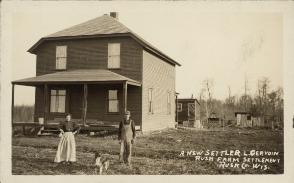 Text on front reads: "A New Settler, L. Gervoin, Rusk Farm Settlement, Rusk Co., Wis." A farm couple and dog are posing in front of their clapboard house with a porch. Farm buildings are in the background on the right.