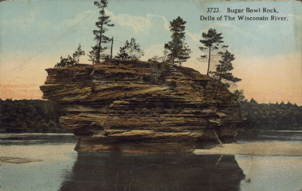 Text on front reads: "Sugar Bowl Rock. Dells of the Wisconsin River." The rock formation in the Lower Dells known as the Sugar Bowl, with trees growing on the top. The wooded shoreline is in the background.