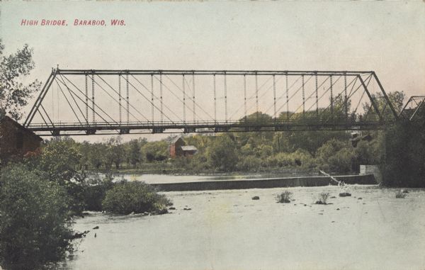 Text on front reads: "High Bridge, Baraboo, Wis." A truss bridge over the Baraboo River with a spillway underneath. The shorelines are wooded and buildings are in the distance.