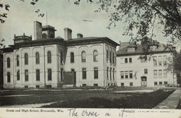 Text on front reads: "Grade and High School, Evansville, Wis." The three-story school was built in 1868 with an addition in 1898. In 1918 a second school, Reitz, was built, and the original school was renamed Central. In 1971, a new Central High School was built and the original building razed in 1979.