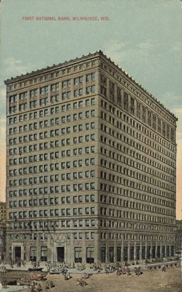 Text on front reads: "First National Bank, Milwaukee, Wis." An early Milwaukee "skyscraper" built of brick in the Neoclassical style. It was built in 1912. Many pedestrians are on the sidewalks and street.
