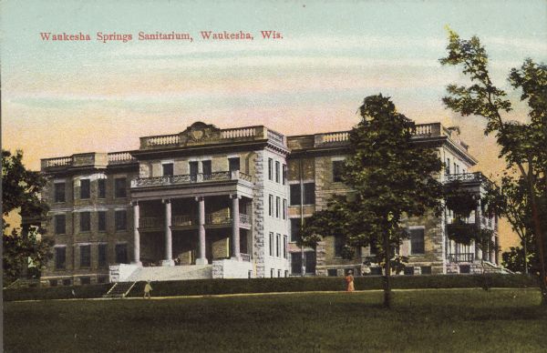 Text on front reads: "Waukesha Springs Sanitarium, Waukesha, Wis." The sanitarium was constructed in 1903 as a large resort/hospital facility by Dr. Byron M. Caples, a well-known psychiatrist. The Sanitarium remained in business until 1941 when Caples retired. The building later served as a men's dormitory for Carroll College.
