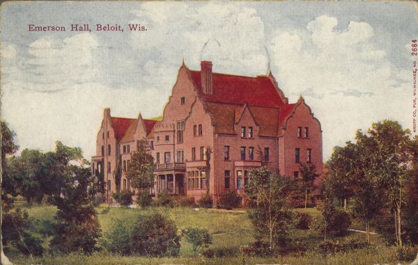 Text on front reads: "Emerson Hall, Beloit, Wis." The Tudor Revival building was constructed in 1897 as a dormitory for women. It is built of brick with many decorative elements, and is surrounded by trees.
