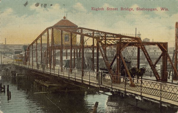 Text on front reads: "Eighth Street Bridge, Sheboygan, Wis." Horse-drawn wagons, automobiles and pedestrians are crossing the Sheboygan River on a truss bridge. Buildings are in the background.