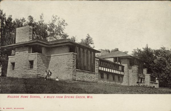 Text on front reads: "Hillside Home School, 4 Miles from Spring Green, Wis." Three boys are posing in front of the school. The Hillside Home School was designed by Frank Lloyd Wright in 1901 for his aunts, Jane and Ellen Lloyd Jones. It was constructed over the next two years.