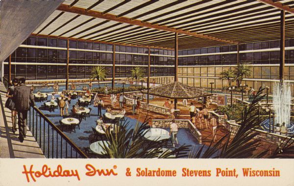 Text on front reads: Holiday Inn & Solardome, Stevens Point, Wisconsin." On reverse: "Holiday Inn & Solardome of Stevens Point. U.S. 51 & N. Point Drive. Stevens Point, Wisconsin 54481. Phone: 715/341-1340. 199 Rooms. Lounge, Restaurant, Meeting Facilities for 1000. Completely enclosed 'SOLARDOME' courtyard featuring swimming pool, ping pong, pool tables, sauna, putting green, shuffleboard, theraputic pool, Exercise equipment, sun lamp area, patio cafe, gift shop and game room." A large indoor area for dining and recreation, filled with people.