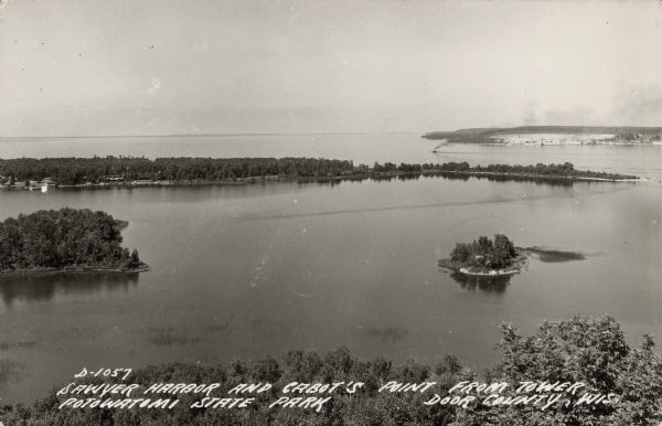Text on front reads: "Sawyer Harbor and Cabot's Point from Tower, Potowatomi State Park, Door County, Wis." Elevated view across Sawyer Harbor towards Sturgeon Bay. A ship is traveling into Green Bay.