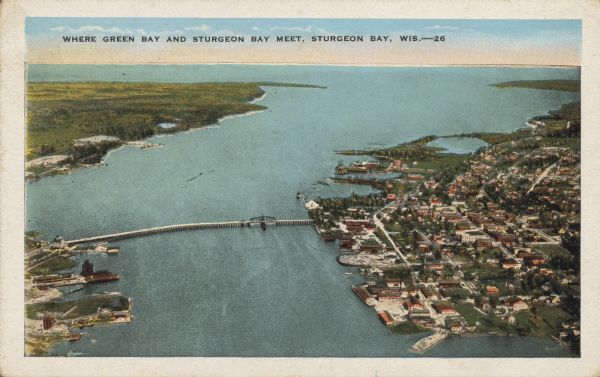 Text on front reads: "Where Green Bay and Sturgeon Bay Meet, Sturgeon Bay, Wis." Aerial view of Sturgeon Bay showing the only bridge in existence at the time.