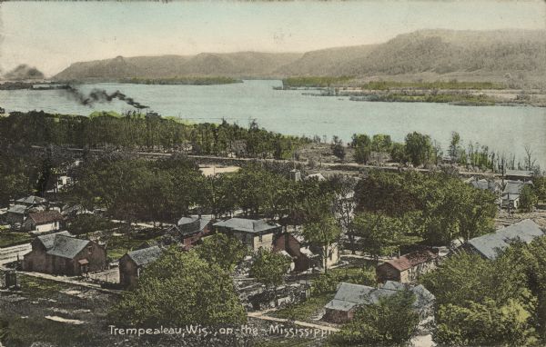 Text on front reads: "Trempealeau, Wis., on-the-Mississippi." Aerial view of the town on the Mississippi River.