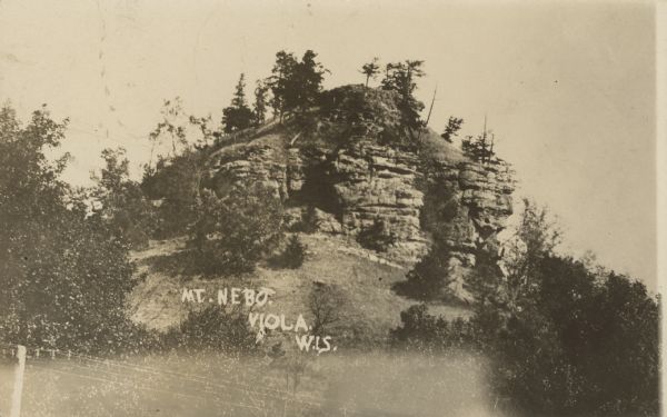 Text on front reads: "Mt. Nebo, Viola, Wis." A rock formation surrounded by trees.