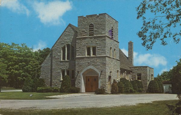 Text on reverse reads: "Trinity Lutheran Church, Washington Island, Wisc." A stone church with trees and shrubs.